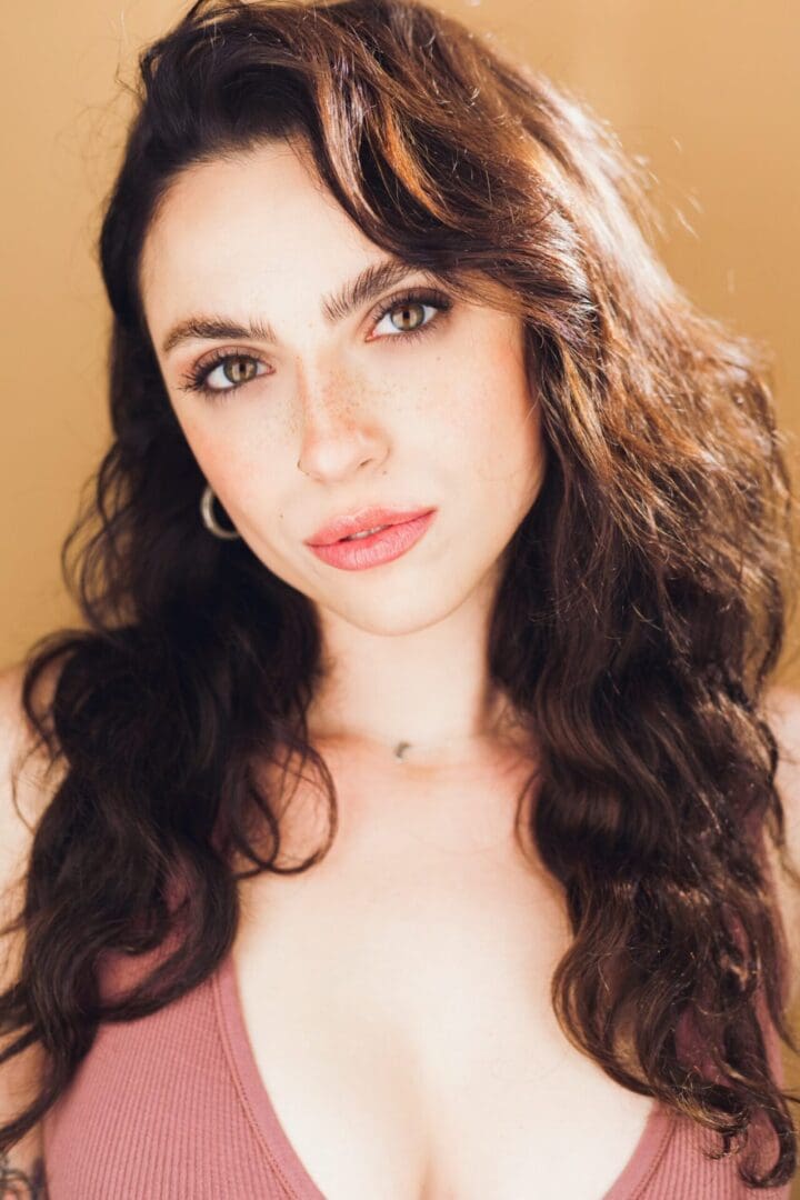 A woman with long hair and green eyes.