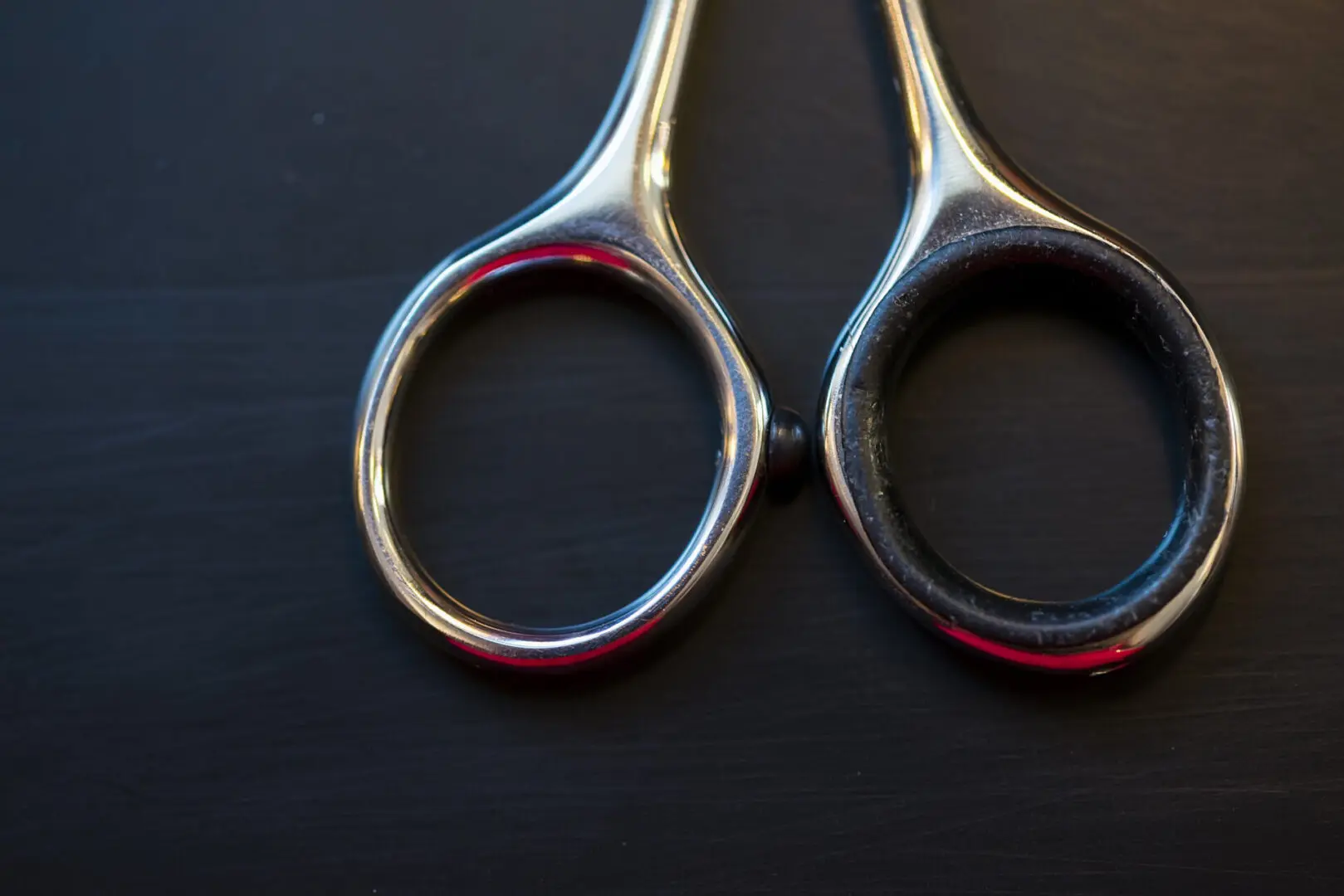 A pair of scissors sitting on top of a table.