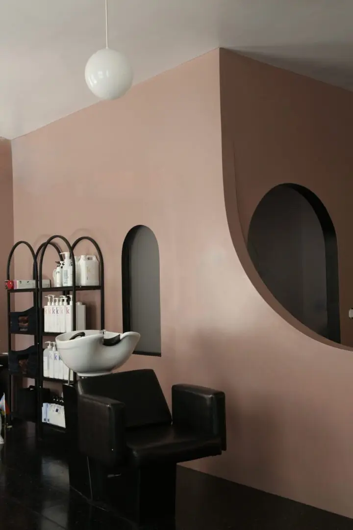 A room with shelves and a sink in it